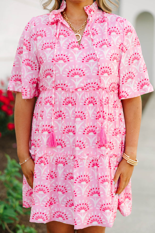 Plus Size fuchsia and light pink patterned tiered mini dress with short sleeves and tassel ties.