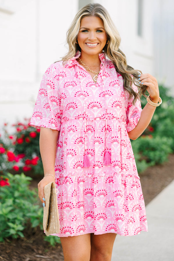 Plus Size fuchsia and light pink patterned tiered mini dress with short sleeves and tassel ties.