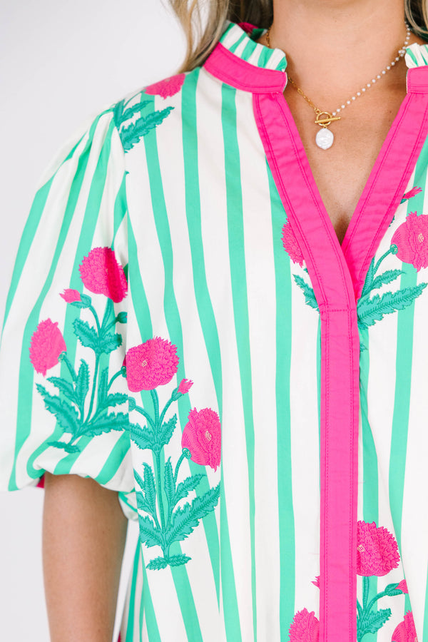 Plus Size green and white striped dress with pink floral print, split v-neck, and puff sleeves.