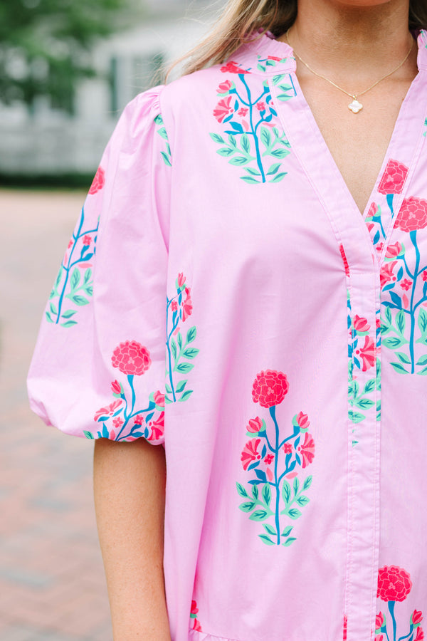Plus Size pink floral cotton dress with a split v-neck, drop waist, and elastic puff sleeves.