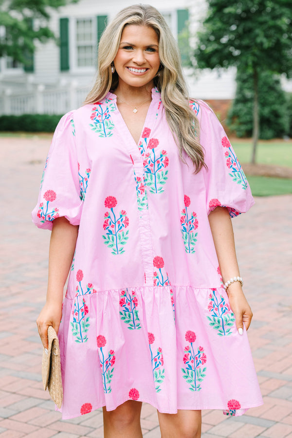 Plus Size pink floral cotton dress with a split v-neck, drop waist, and elastic puff sleeves.