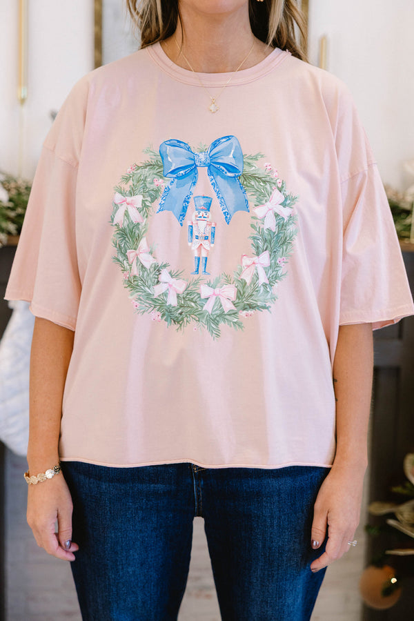 Chic Soul plus size clothing, blush pink short sleeve slightly cropped short top with green wreath with blue bow in the middle and cream pink bows all around and nutcracker in the middle