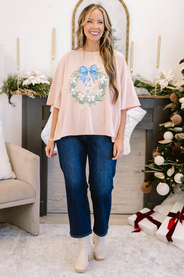 Chic Soul plus size clothing, blush pink short sleeve slightly cropped short top with green wreath with blue bow in the middle and cream pink bows all around and nutcracker in the middle