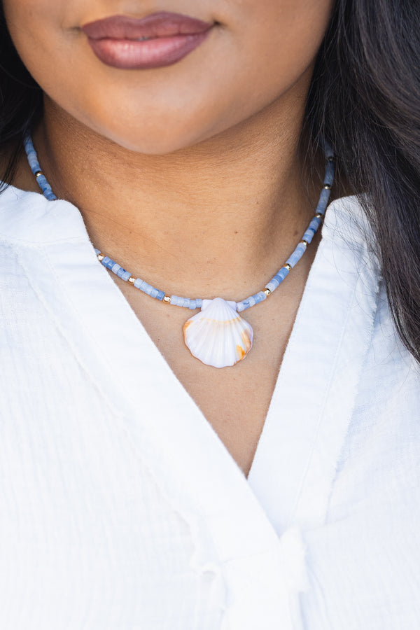 Chic Soul plus size clothing, blue beaded necklace with a seashell charm hanging off the center of the beads 
