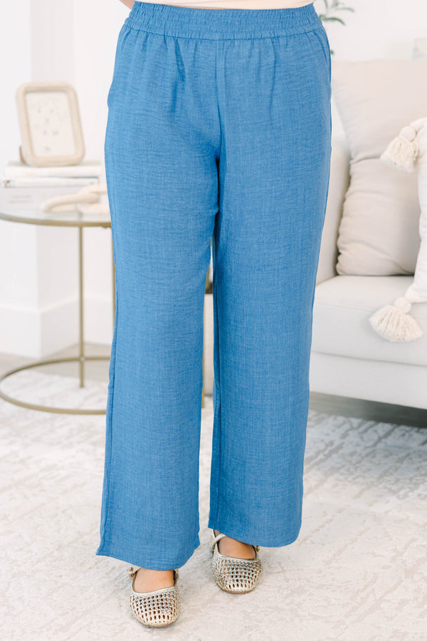 Plus size blue denim-look wide-leg pants with a comfortable elastic waist and flowy fit.