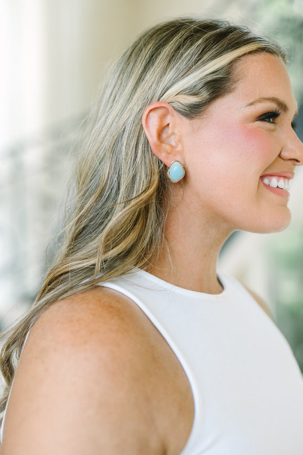 Plus Size irregular gold-rimmed stud earrings with smooth, light blue stone centers.