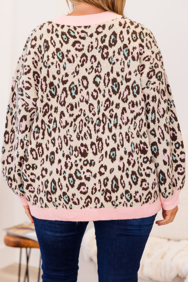 Chic Soul plus size clothing, long-sleeve pink sweater top with brown and turquoise leopard print pattern and color block pink neckline and wrist line
