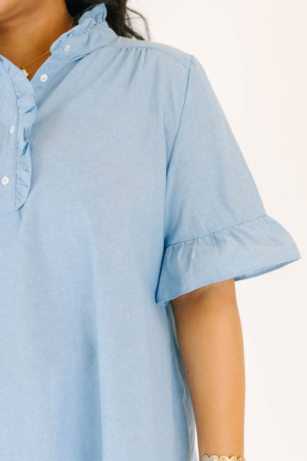 Plus Size chambray top with a ruffled collar, button-up neckline, and short ruffle-cuff sleeves.