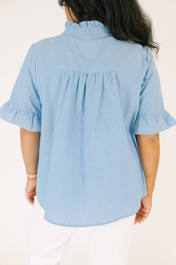 Plus Size chambray top with a ruffled collar, button-up neckline, and short ruffle-cuff sleeves.