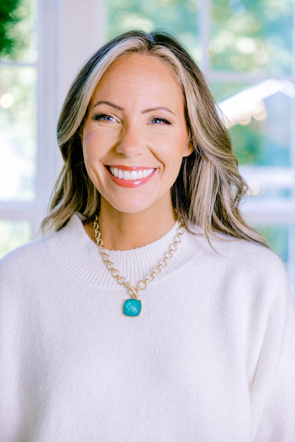 Chic Soul plus size clothing, gold charm necklace with a blue-green square stone that hangs from the center of the necklace