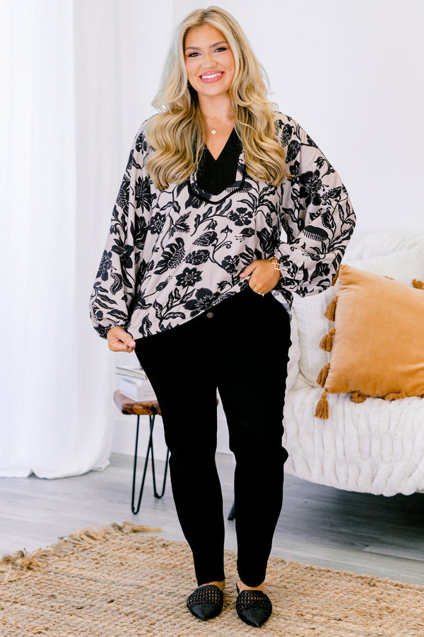 Chic Soul plus size clothing, taupe long sleeve blouse with a black floral pattern and black accents around the v-neckline 
