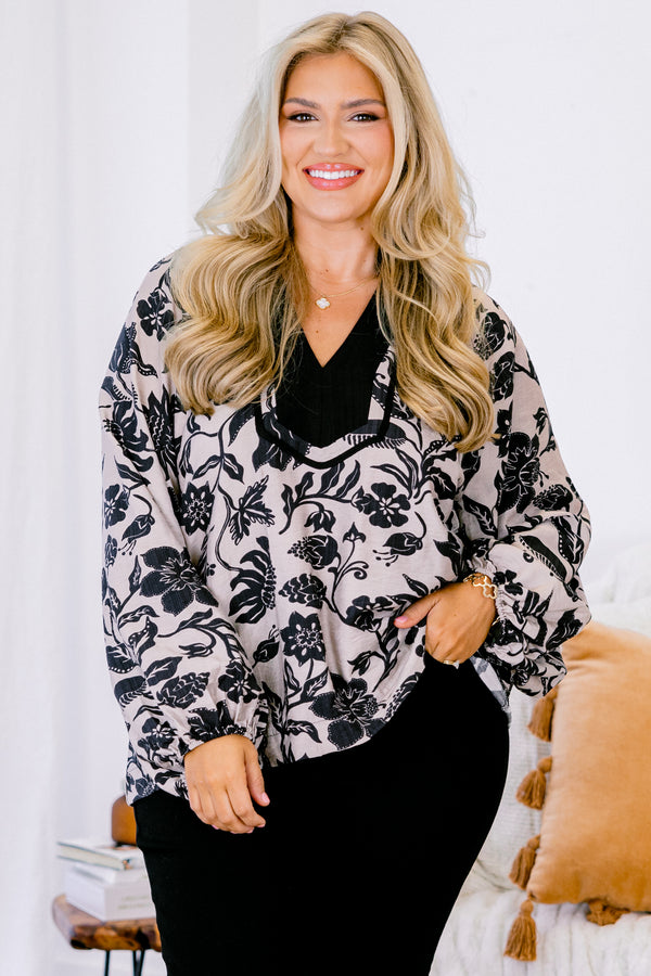 Chic Soul plus size clothing, taupe long sleeve blouse with a black floral pattern and black accents around the v-neckline 
