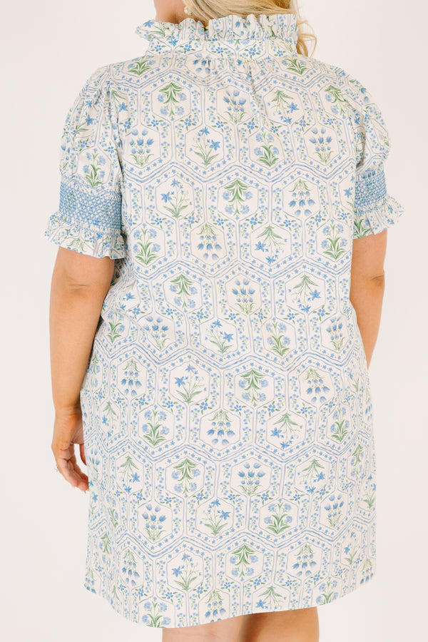 Chic Soul plus size clothing, blue knee length dress with bubble sleeves that have blue stitching details on the ends of sleeves and a floral block pattern throughout 