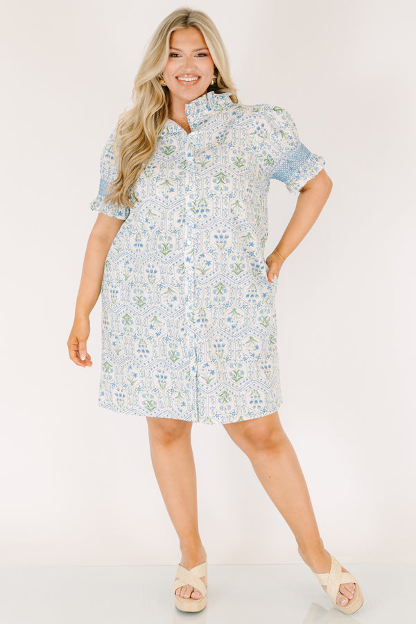 Chic Soul plus size clothing, blue knee length dress with bubble sleeves that have blue stitching details on the ends of sleeves and a floral block pattern throughout 