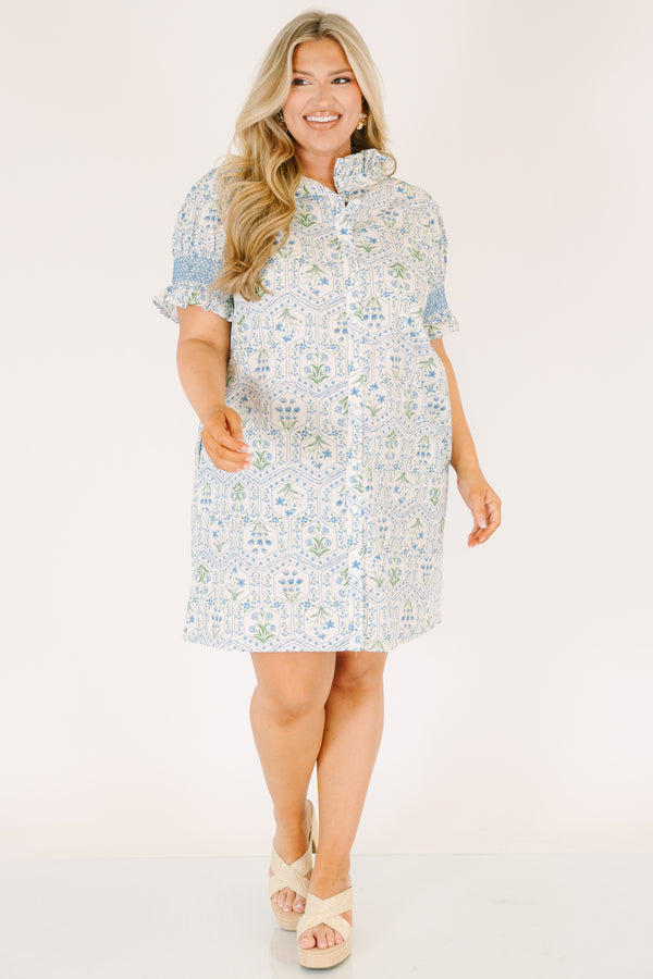 Chic Soul plus size clothing, blue knee length dress with bubble sleeves that have blue stitching details on the ends of sleeves and a floral block pattern throughout 