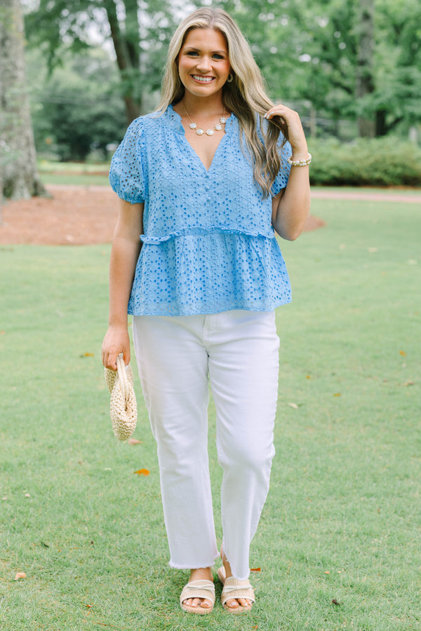 Plus Size blue eyelet babydoll top with short puff sleeves, V-neckline, and button-front detail.