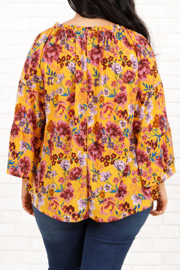 Chic Soul plus size clothing, marigold and mauve floral pattern top with bell sleeves and ruffle details on neckline