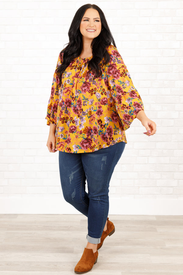 Chic Soul plus size clothing, marigold and mauve floral pattern top with bell sleeves and ruffle details on neckline