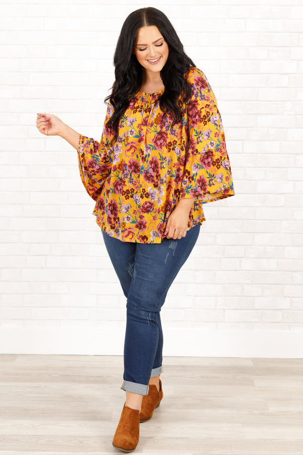 Chic Soul plus size clothing, marigold and mauve floral pattern top with bell sleeves and ruffle details on neckline