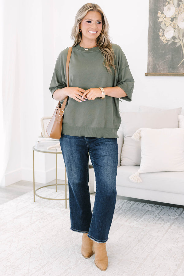 Plus size olive green short sleeve sweater with a relaxed fit and ribbed crew neckline.