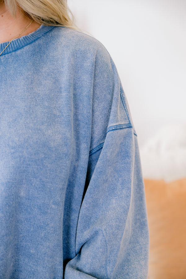 Chic Soul plus size clothing, dusty blue long sleeve pullover with cinched sleeves at the wrist and a loose waistband 