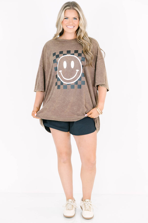 Plus Size mahogany acid wash relaxed tee with a checkered smiley face graphic and black shorts.