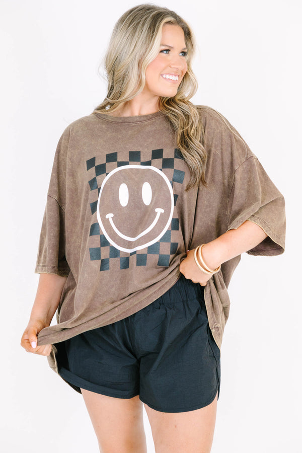 Plus Size mahogany acid wash relaxed tee with a checkered smiley face graphic and black shorts.