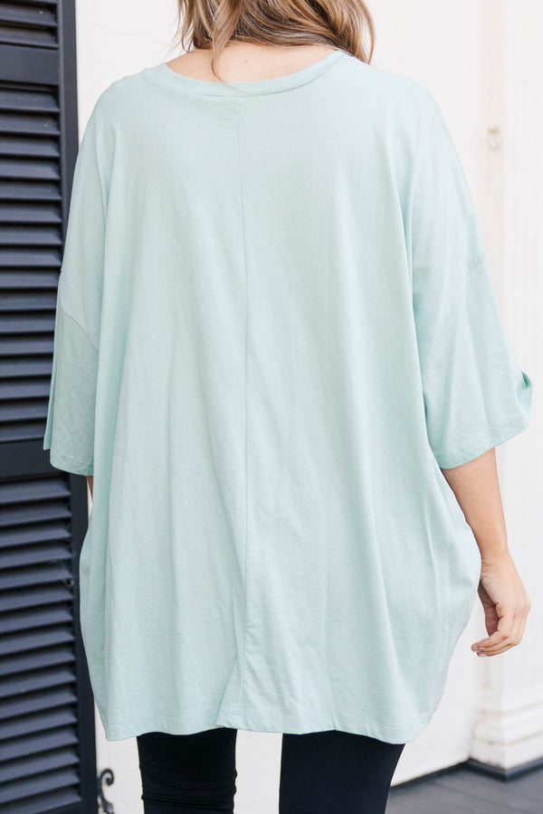 Chic Soul plus size clothing, light green faded teal colored oversized tee with smiley face graphic in military green
