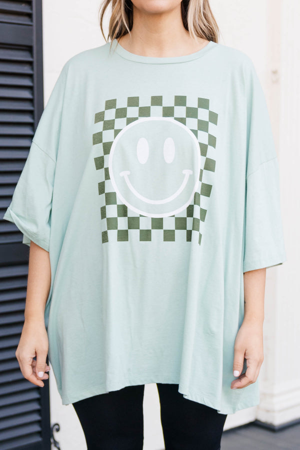 Chic Soul plus size clothing, light green faded teal colored oversized tee with smiley face graphic in military green
