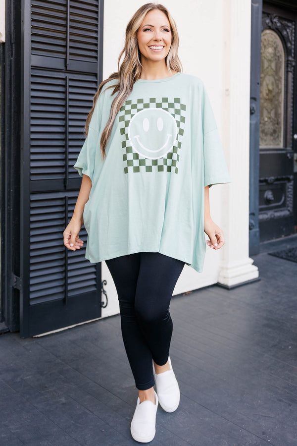 Chic Soul plus size clothing, light green faded teal colored oversized tee with smiley face graphic in military green