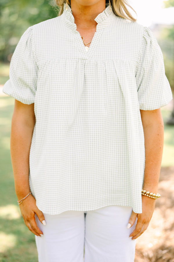 Plus Size green and white gingham top with puff sleeves, a ruffled collar, and a split neckline.