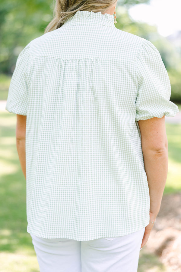 Plus Size green and white gingham top with puff sleeves, a ruffled collar, and a split neckline.