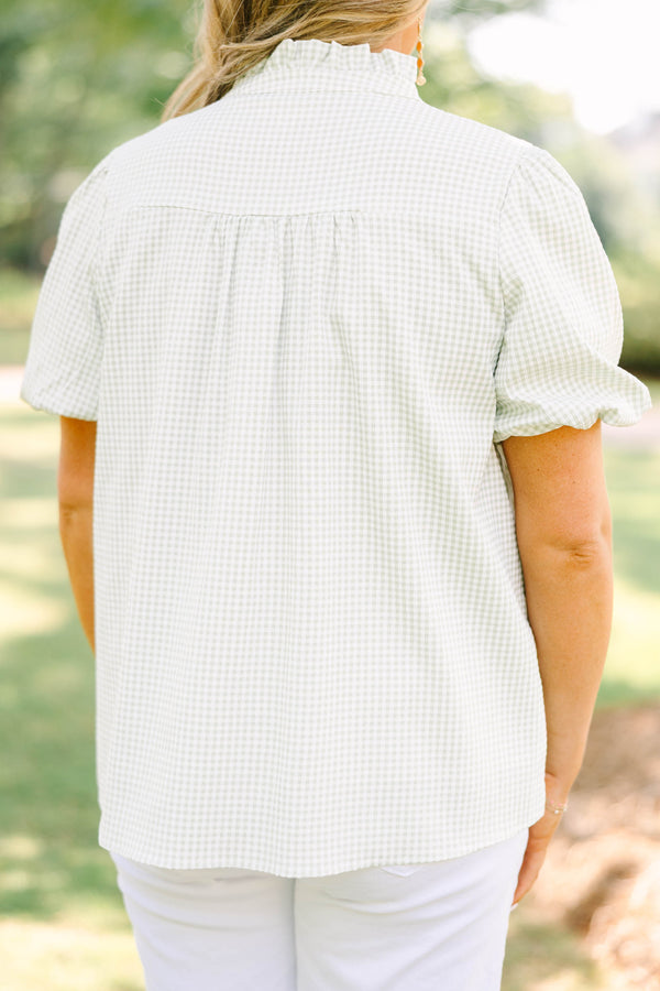 Plus Size green and white gingham top with puff sleeves, a ruffled collar, and a split neckline.