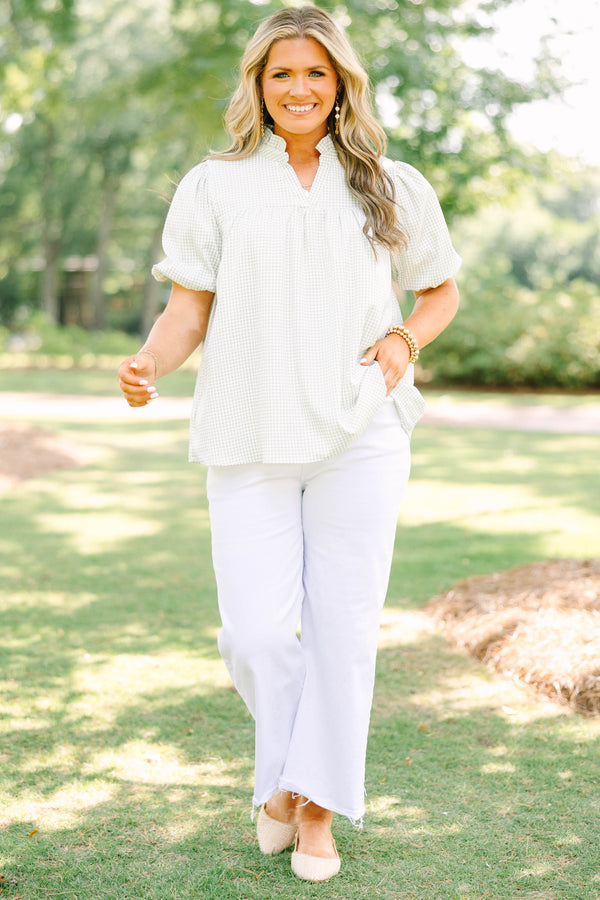 Plus Size green and white gingham top with puff sleeves, a ruffled collar, and a split neckline.