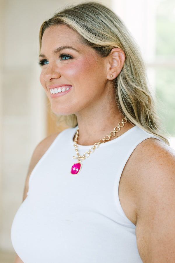 Plus Size gold chain necklace with a large fuchsia square pendant and matching gold stud earrings.
