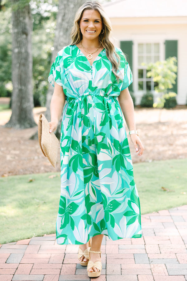 Chic Soul plus size clothing, short-sleeve green flowy dress with a v-neckline and a smocked tied waistline with a blue and green tropical floral pattern