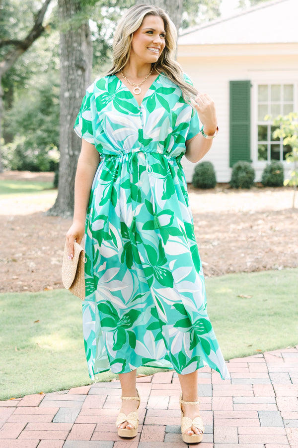 Chic Soul plus size clothing, short-sleeve green flowy dress with a v-neckline and a smocked tied waistline with a blue and green tropical floral pattern