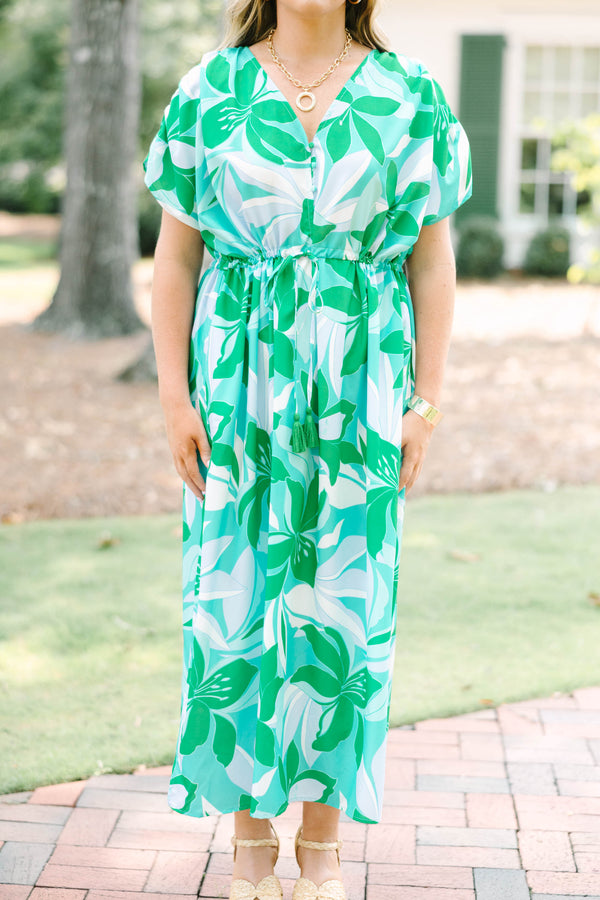Chic Soul plus size clothing, short-sleeve green flowy dress with a v-neckline and a smocked tied waistline with a blue and green tropical floral pattern