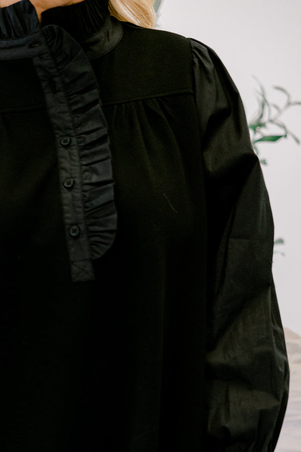 Chic Soul plus size clothing, black long sleeve dress with button details going down to the chest as well as ruffle details going down the neckline 