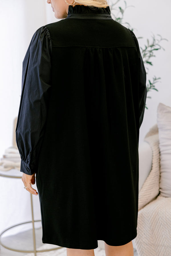 Chic Soul plus size clothing, black long sleeve dress with button details going down to the chest as well as ruffle details going down the neckline 