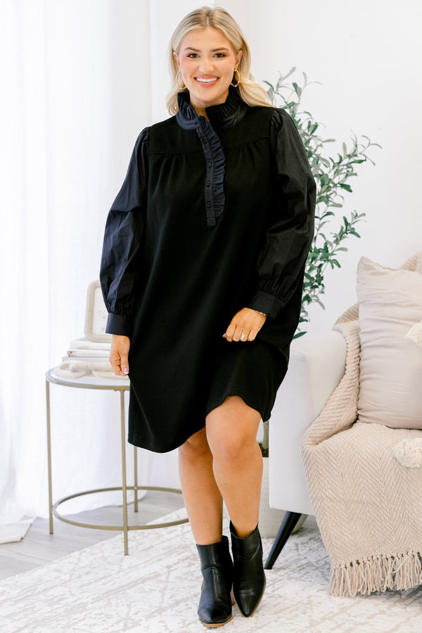 Chic Soul plus size clothing, black long sleeve dress with button details going down to the chest as well as ruffle details going down the neckline 