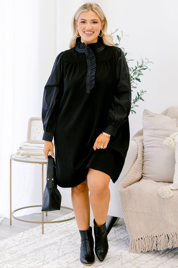 Chic Soul plus size clothing, black long sleeve dress with button details going down to the chest as well as ruffle details going down the neckline 
