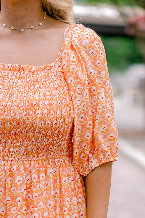 Chic Soul plus size clothing, orange, short sleeve, tiered, maxi dress with white floral block pattern and rouching on the chest .