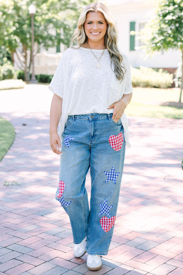 Plus Size straight leg jeans in light wash denim with red and blue gingham heart and star patches.