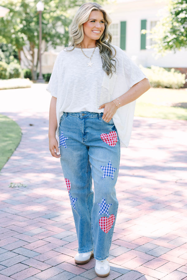 Plus Size straight leg jeans in light wash denim with red and blue gingham heart and star patches.