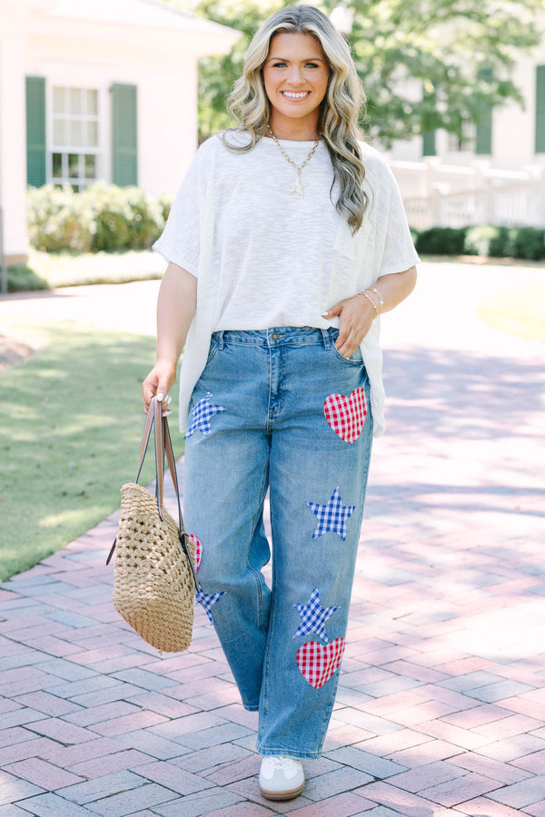 Plus Size straight leg jeans in light wash denim with red and blue gingham heart and star patches.