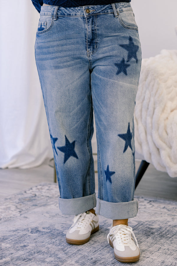 Chic Soul plus size clothing, medium washed jeans with dark denim star patches throughout the jeans as well as cuffs at the end of each pant leg