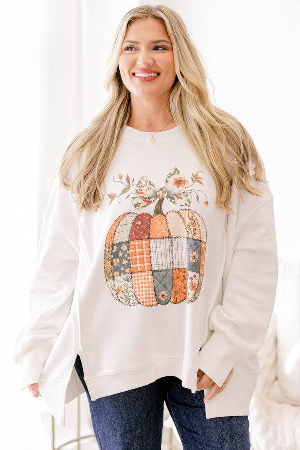 Chic Soul plus size clothing, off white crewneck with a quilt patch patterned pumpkin topped with a bow on the stem 