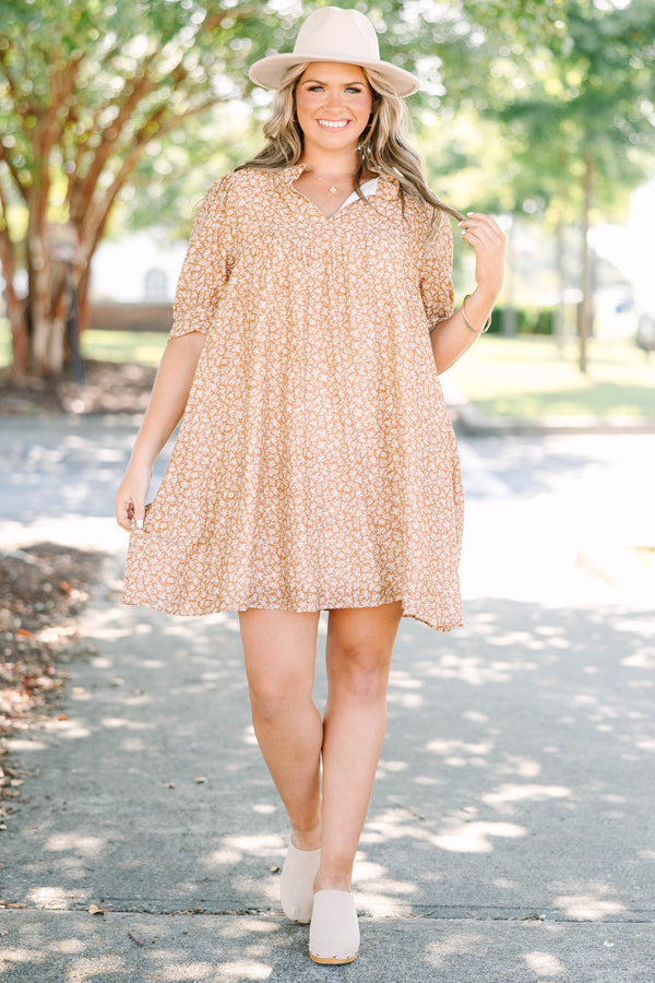 Plus Size brown floral mini dress with a V-neckline, short puff sleeves, and a relaxed babydoll fit.