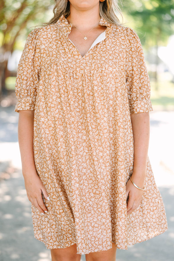 Plus Size brown floral mini dress with a V-neckline, short puff sleeves, and a relaxed babydoll fit.